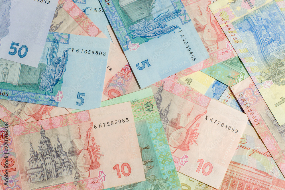 Ukrainian money. Hryvnia paper bill. Small paper notes. Cash. Background texture. Ukrainian money. Hryvnia paper bill. Small paper notes. Cash. Background texture.