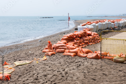 Canvas Print Plastic flood protection sandbags stacked into a temporary wall