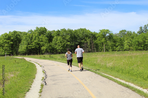Man and woman running at Miami Woods in Morton Grove, Illinois