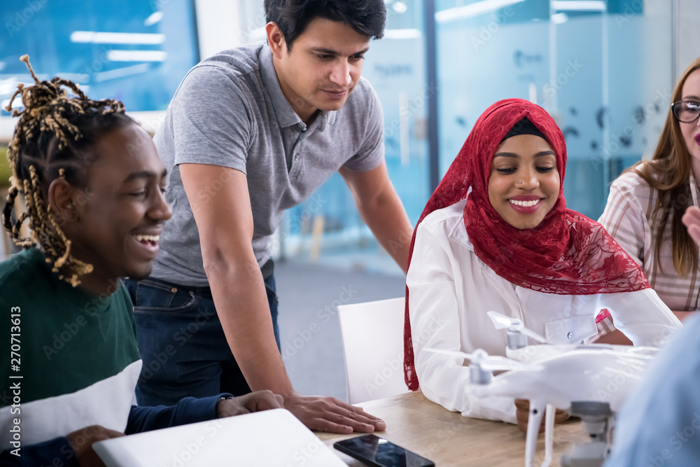 Fototapeta premium multiethnic business team learning about drone technology