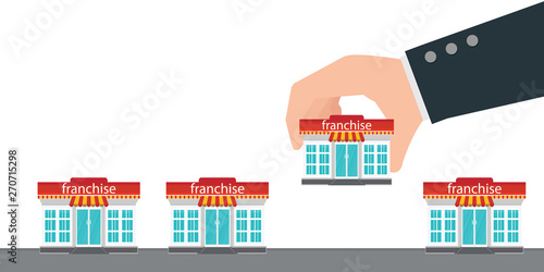 Human hand holding small store or franchise.
