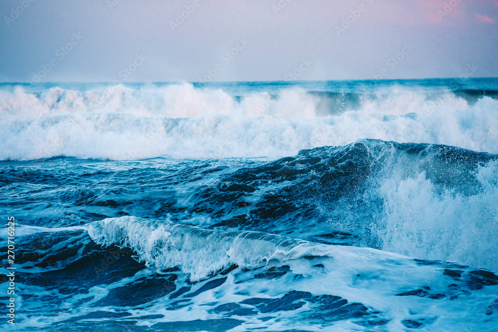 Naklejka premium Waves at Beach at Sunset