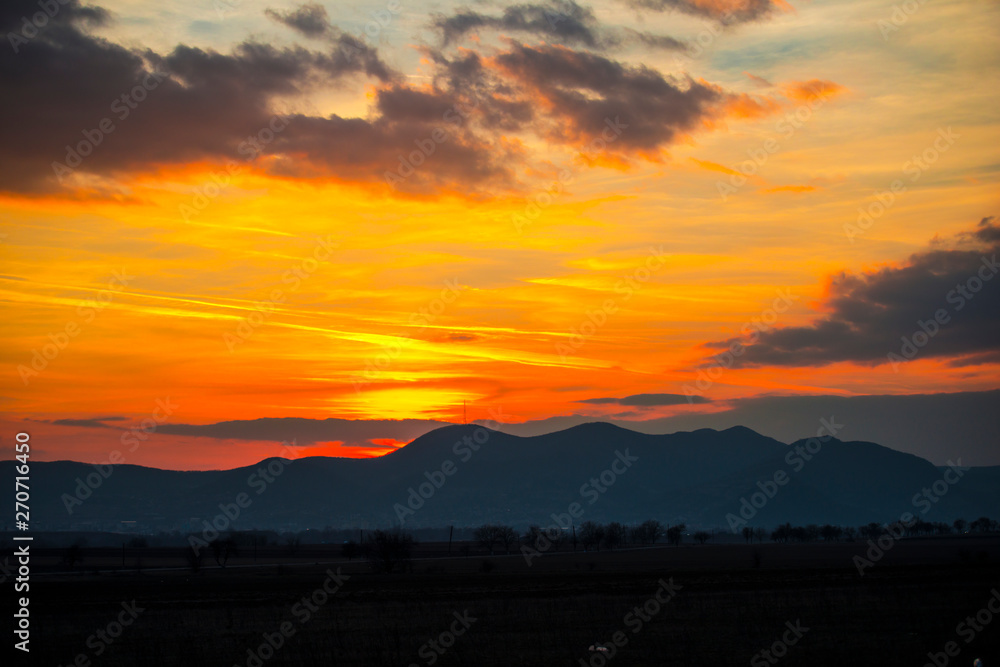 Fototapeta premium Orange sky landscape at the sunset