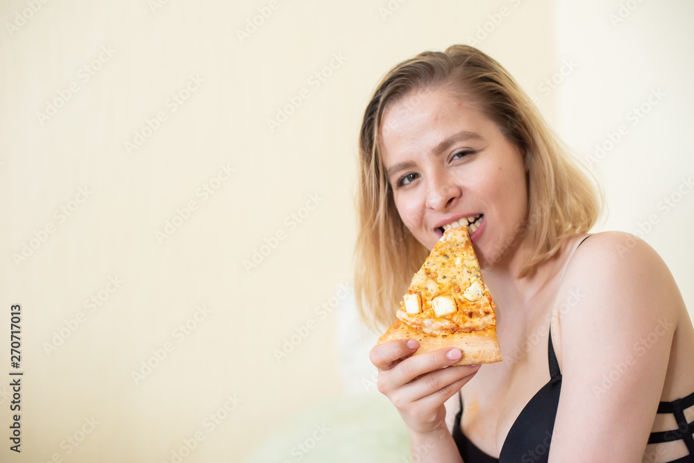 European girl with short hair posing with pieces of delicious pizza. European girl with short hair posing with pieces of delicious pizza.