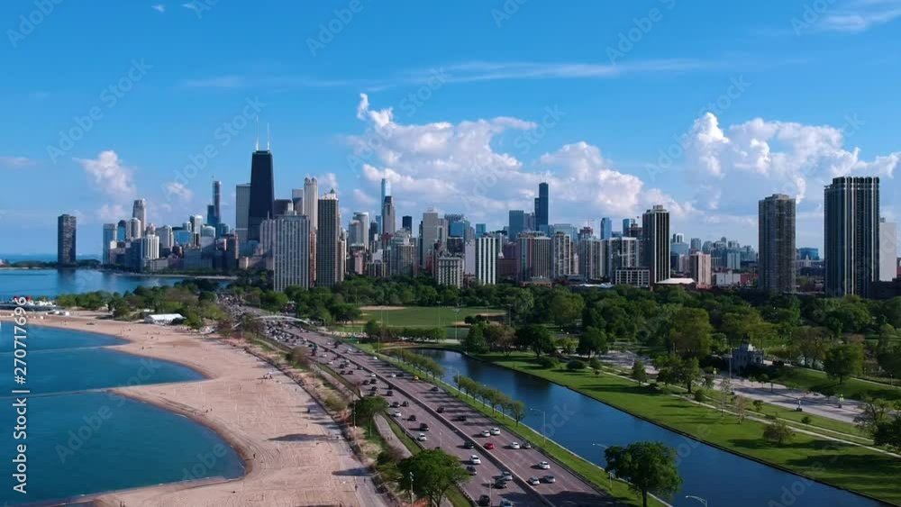aerial drone view of the Chicago downtown skyline North ave beach during the summertime afternoon. clear skies and clam waters while Tourist travel the city aerial drone view of the Chicago downtown skyline North ave beach during the summertime afternoon. clear skies and clam waters while Tourist travel the city