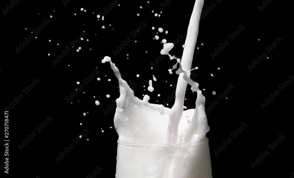 white milk splash on dark background