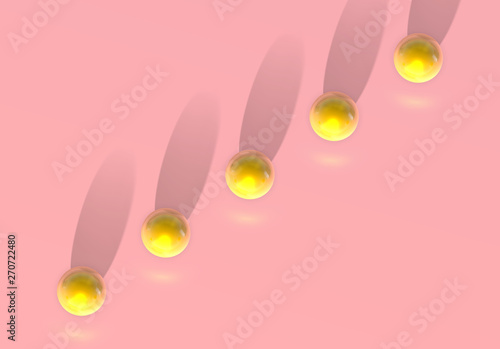 Abstract pink background with golden ball jumping in top view unusual perspective