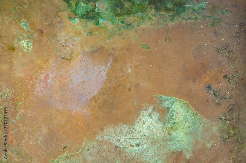 Grunge texture of verdigris oxidized on the surface of copper or brass as a background photo