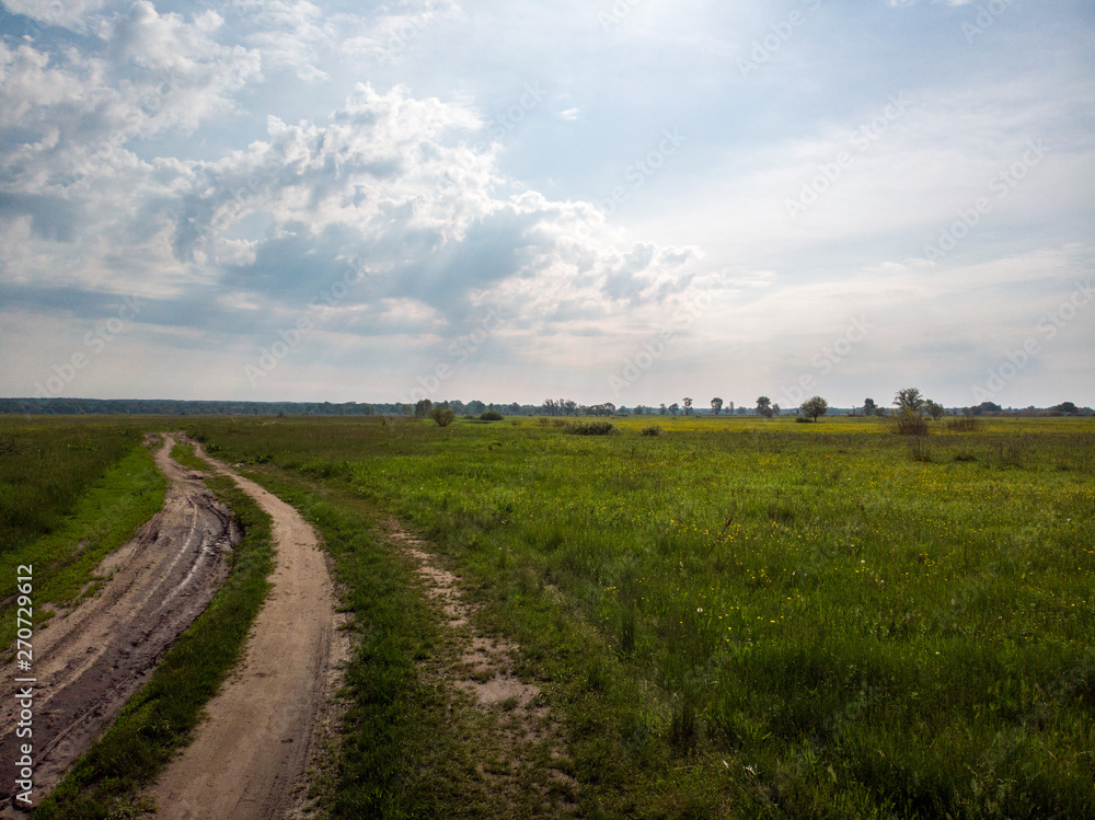 Green field with road path that is split. Kiev, Ukraine Green field with road path that is split. Kiev, Ukraine