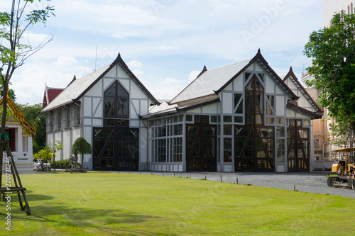 Canvas Print The exterior view of the National Museum with green grass lawn in Bangkok,Thaila
