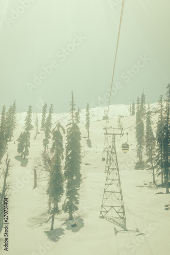 Cable car at snow mountain in Gulmark Kashmir, India . ( Filtered image processed vintage effect. ) photo