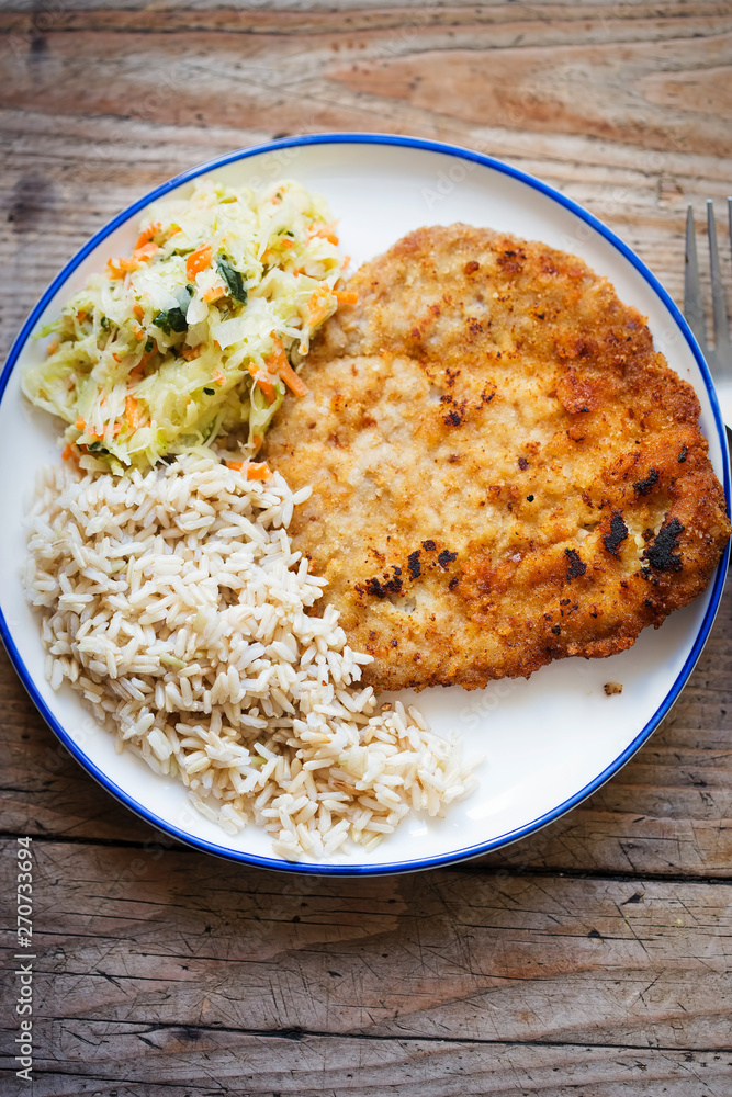 Polish breaded pork cutlet with rice and vegetable salad Polish breaded pork cutlet with rice and vegetable salad