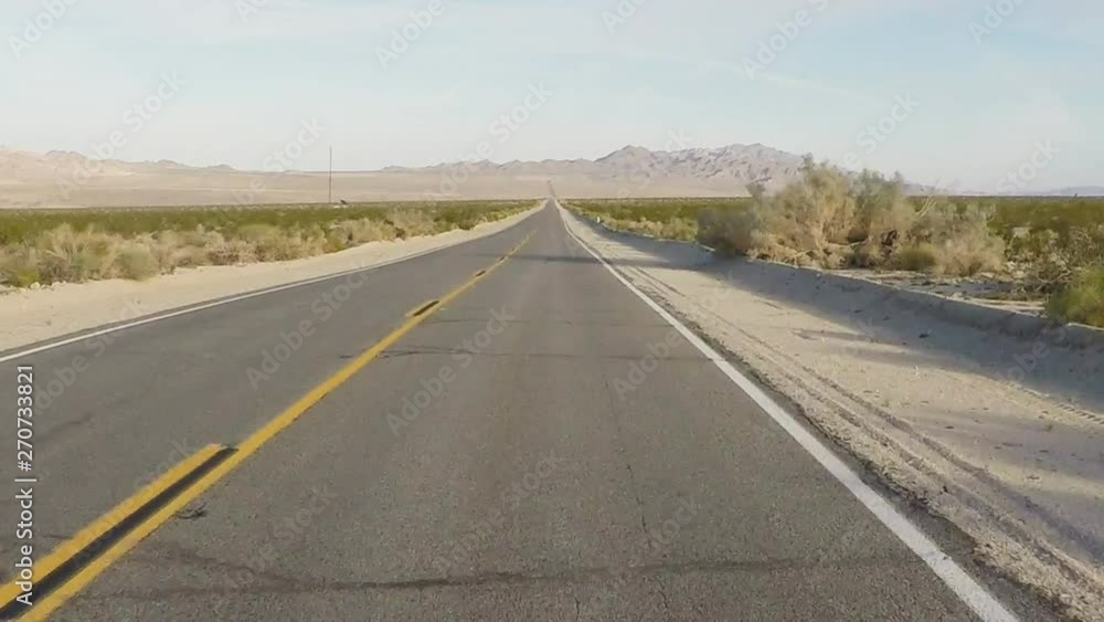 Car Viewpoint- Mojave Desert Highway Stretching To Horizon Car Viewpoint- Mojave Desert Highway Stretching To Horizon
