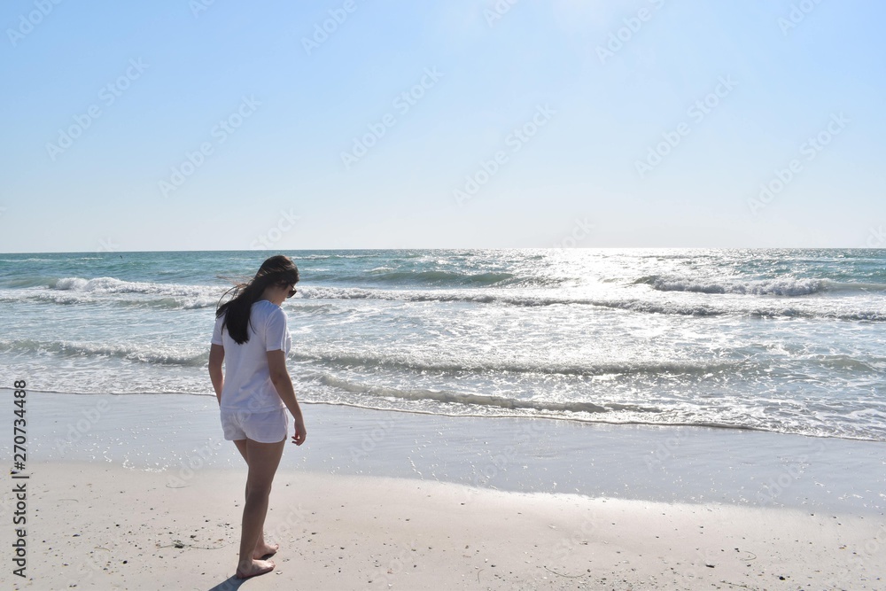 woman walking on the beach