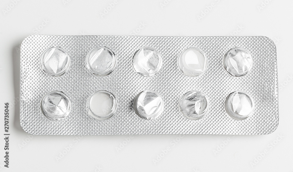Silver blister packs pills isolated on white - obrazy, fototapety, plakaty 