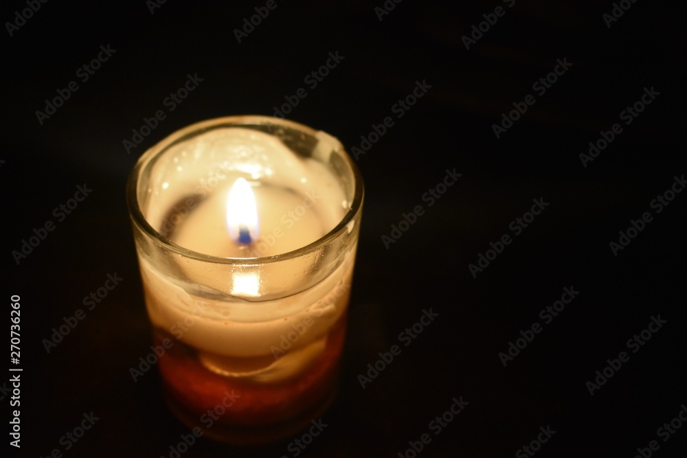 Candle lit on a dark night Candle lit on a dark night
