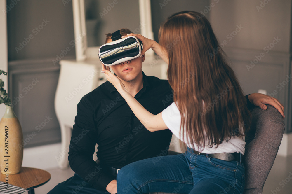young couple spend time together playing VR in living room young couple spend time together playing VR in living room