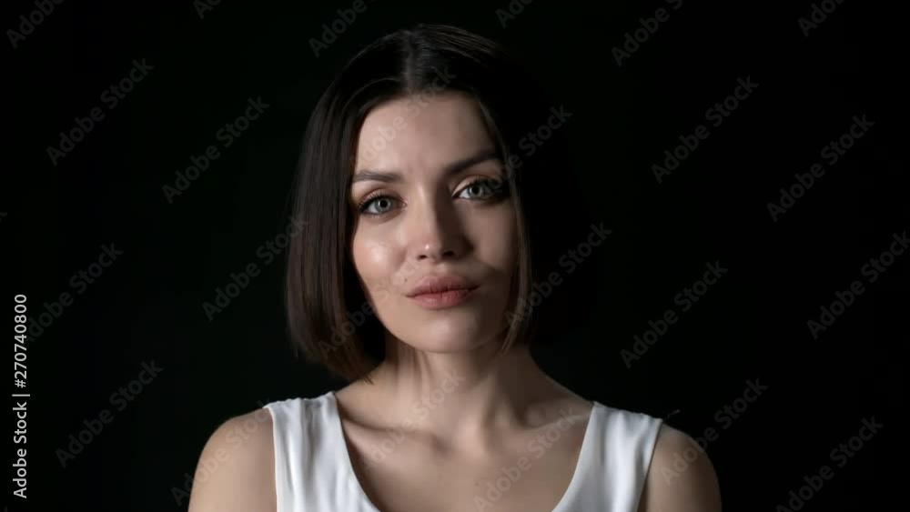 Lockdown of young Caucasian woman on black background Lockdown of young Caucasian woman on black background