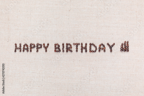 The words Happy Birthday written with coffee beans , aligned in the center.