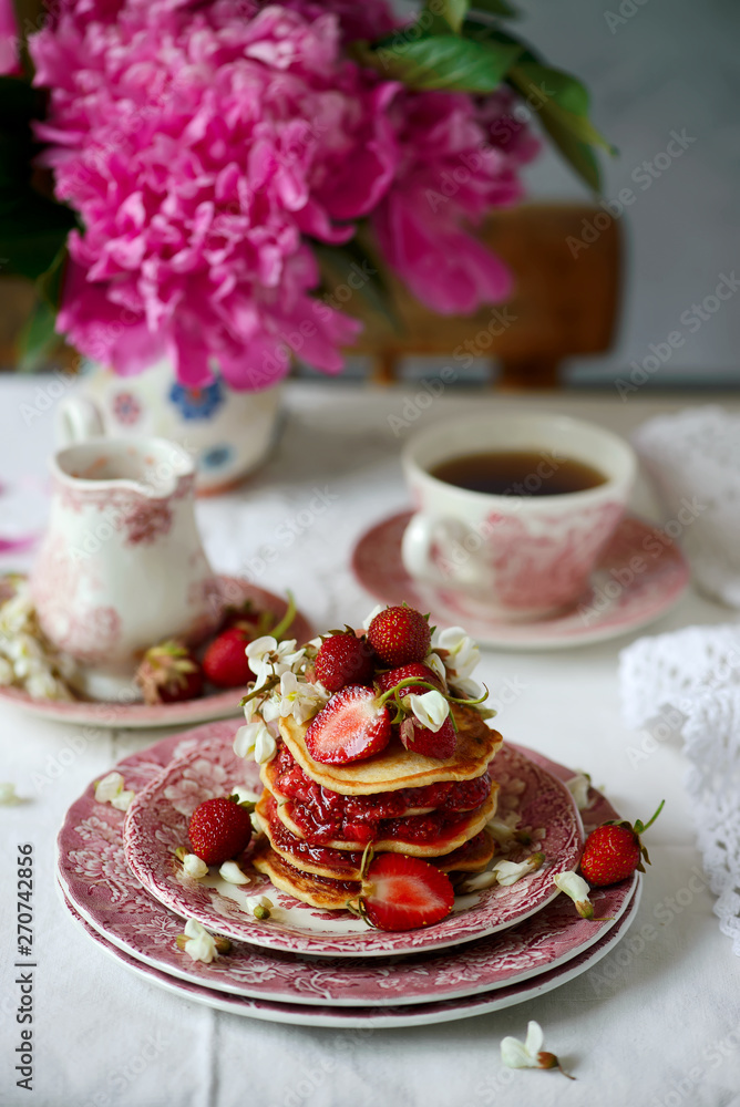 Pancakes with acacia flowers and strawberry chia sauce