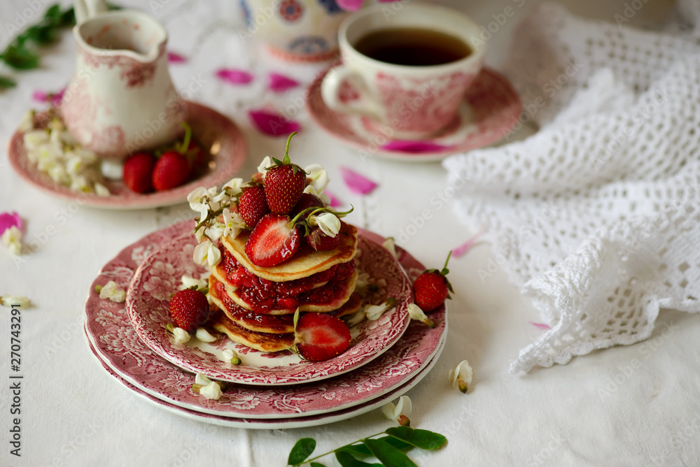 Pancakes with acacia flowers and strawberry chia sauce Pancakes with acacia flowers and strawberry chia sauce