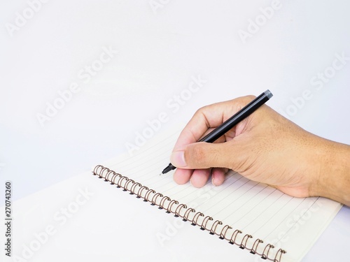 hand with pen and notebook isolated on white background