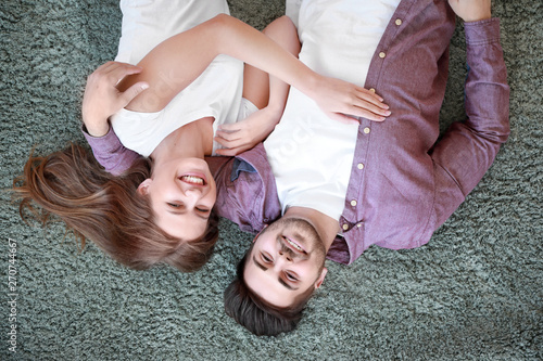 Young couple lying on soft ...