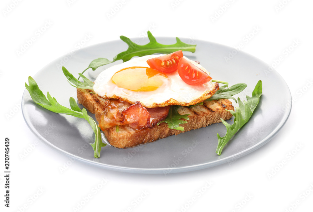 Plate with grilled bread, fried egg and bacon on white background