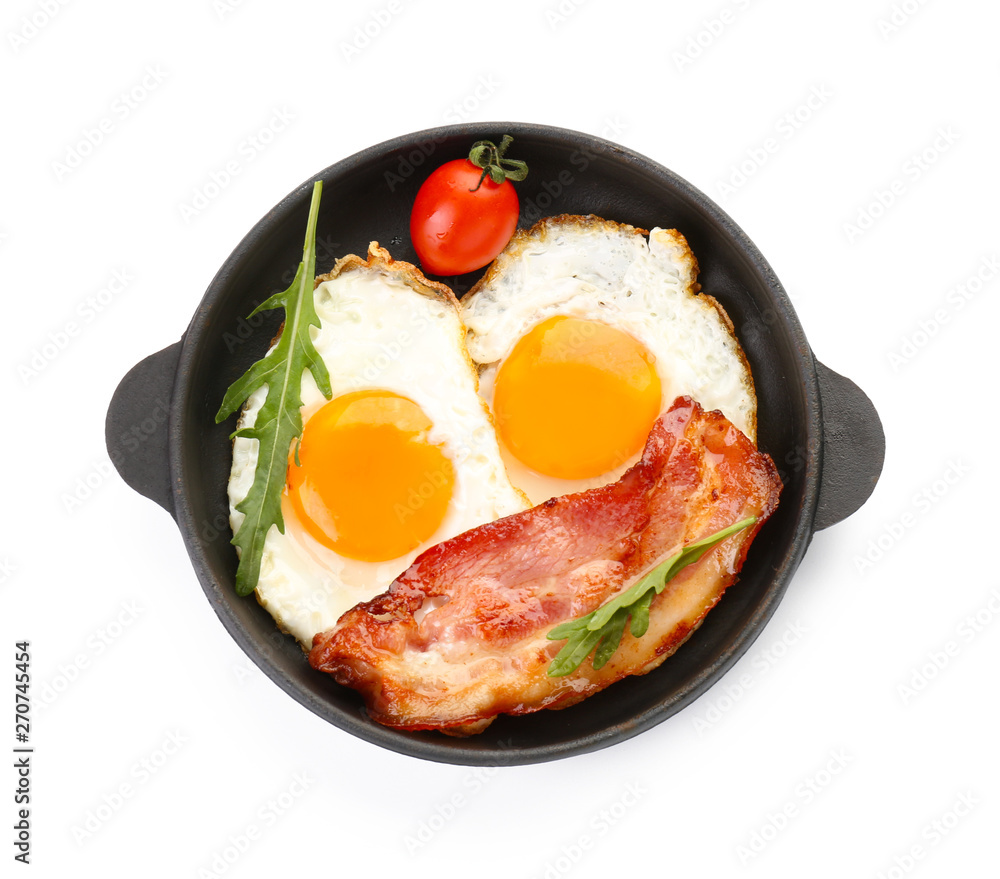 Frying pan with eggs and bacon on white background Frying pan with eggs and bacon on white background