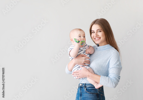 Happy mother with cute litt...