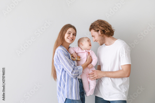Happy parents with cute lit...