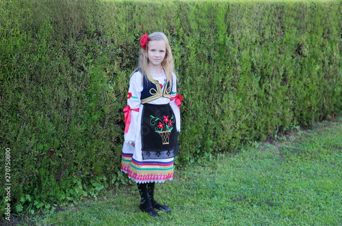 Serbian girl in traditional clothes, national costume, identity culture of Serbia.