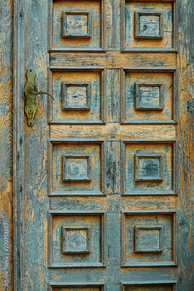 vintage wooden door and old white wall as background