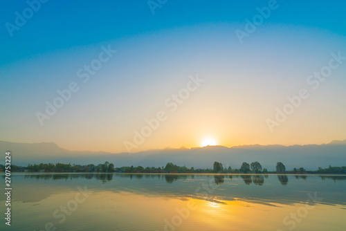 Sunrise on Dal lake  Kashmir India .