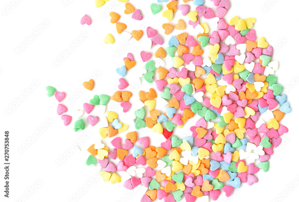 Sugar sprinkle dots hearts, decoration for cake and bakery. Colorful sugar sprinkles scattered on white background 