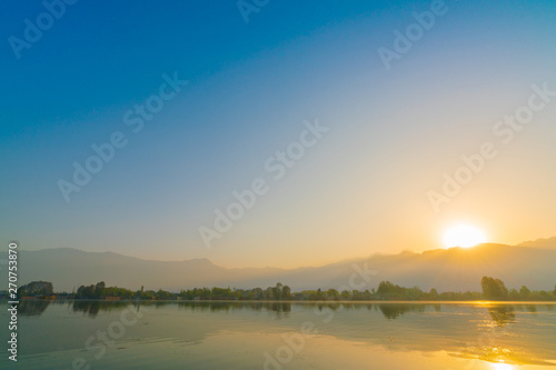 Sunrise on Dal lake, Kashmir India . © jannoon028