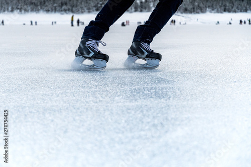 braking ice skates on frozen lake