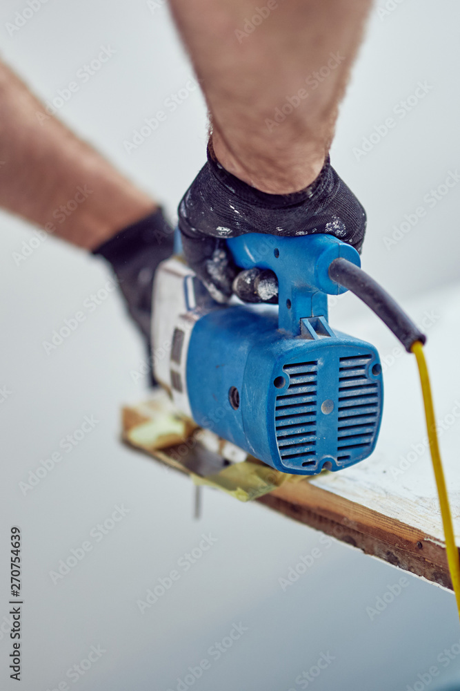 Handyman fixing / working on a house renovation.
