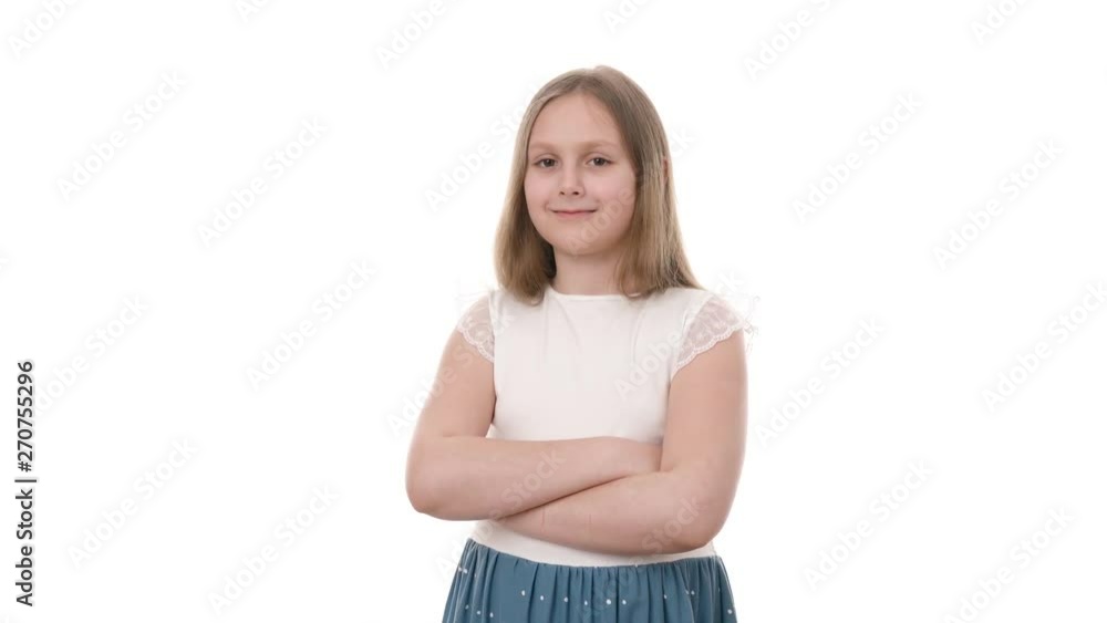 Video portrait of happy smiling child girl with tricky look isolated on white background. Childhood concept. Studio shot of child emotions in 4K definition. Video portrait of happy smiling child girl with tricky look isolated on white background. Childhood concept. Studio shot of child emotions in 4K definition.