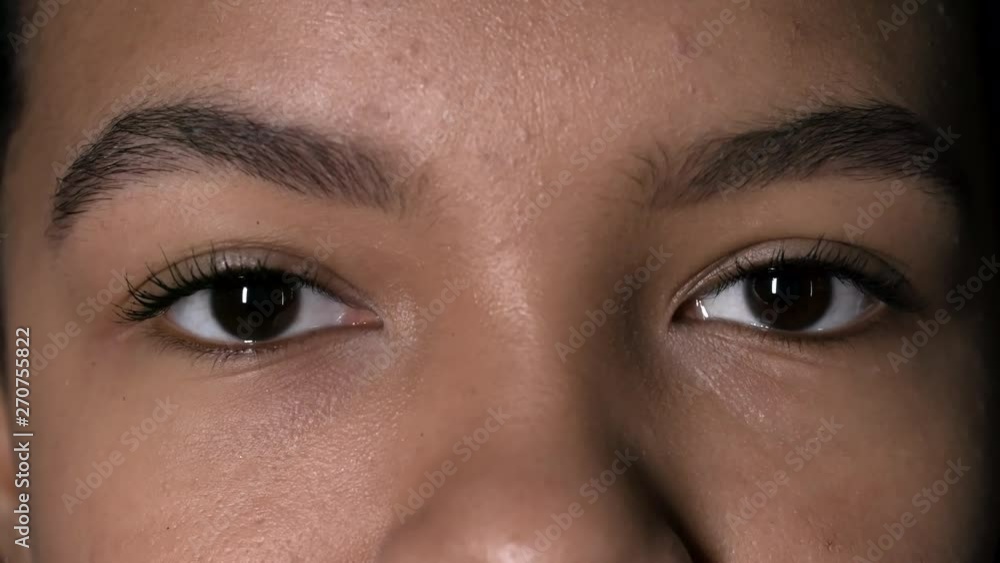 Macro of upper face and two brown eyes looking at camera and blinkingMacro of upper face and two brown eyes looking at camera and blinking Macro of upper face and two brown eyes looking at camera and blinkingMacro of upper face and two brown eyes looking at camera and blinking