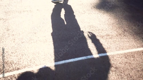 Dribbling basketball player on the court with the ball  slow motion .