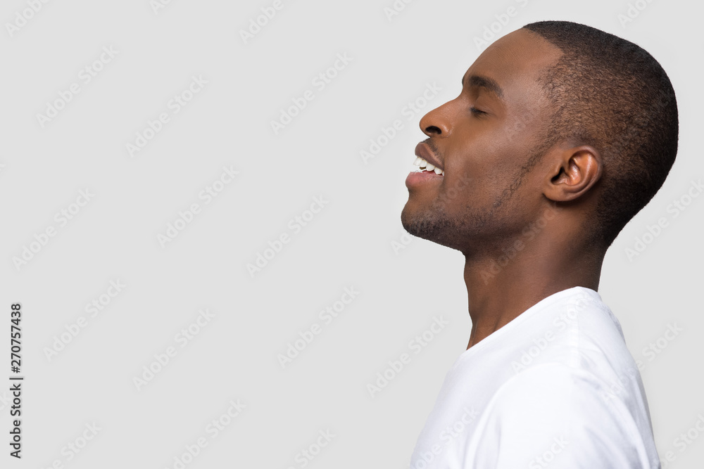 Foto de Side profile african man face closed eyes enjoy fresh air do Stock  | Adobe Stock