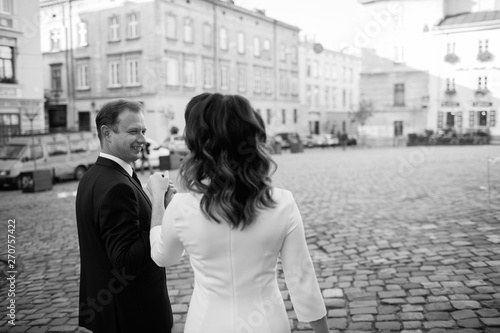 Bride and Groom on Wedding Day in city.