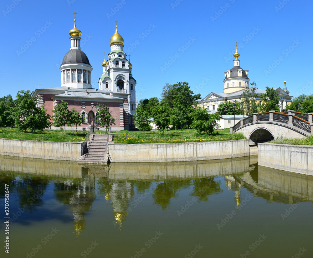 The church, the pond and the bridge are part of the Old Believer Center, formed in the 18th century on the site of the Rogozhskaya settlement. Russia, Moscow, May 2019.
