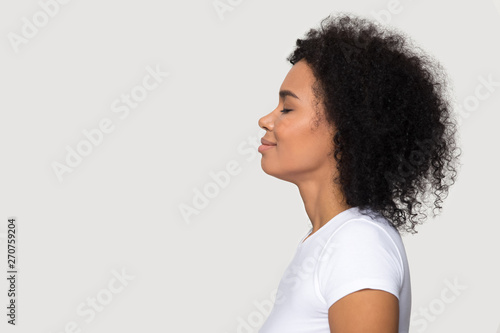 Side profile view african woman closed eyes dreaming