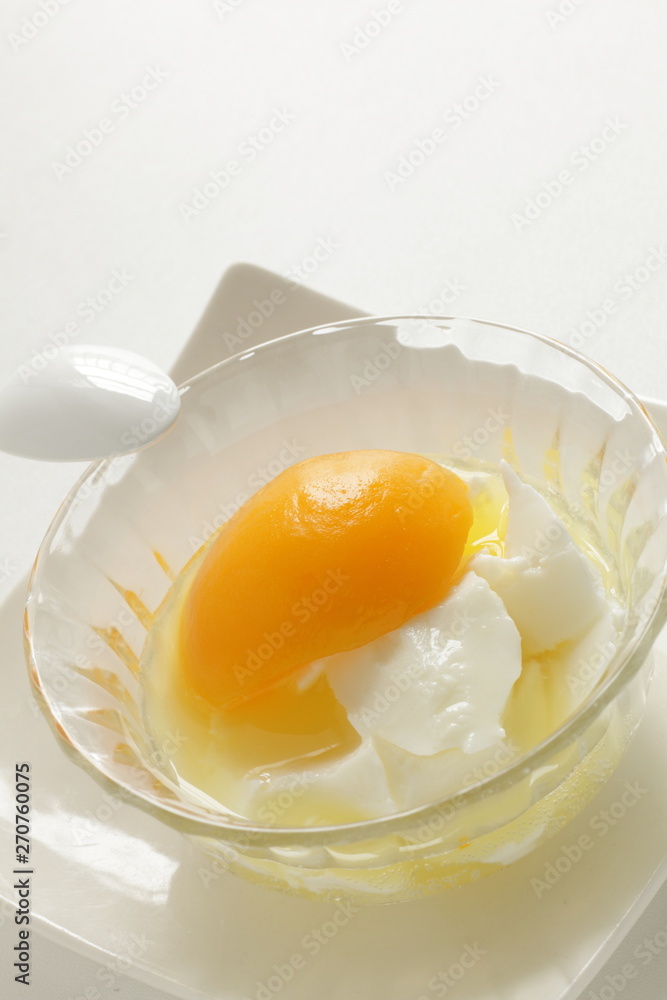 Chinese dessert, peach and almond tofu on glass bowl Chinese dessert, peach and almond tofu on glass bowl