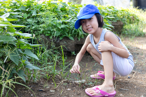 Asian Chinese Little Girl playing at organic farm
