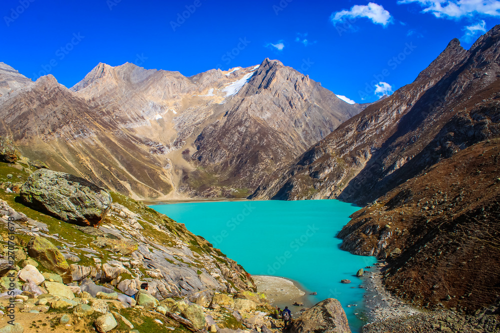 Deep green water of Sheshnag Lake in the vicinity of Amarnath Cave in Kashmir. Sheshnag Lake viewed from above