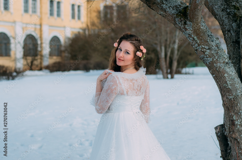 Bride with roses in hair turned back Bride with roses in hair turned back