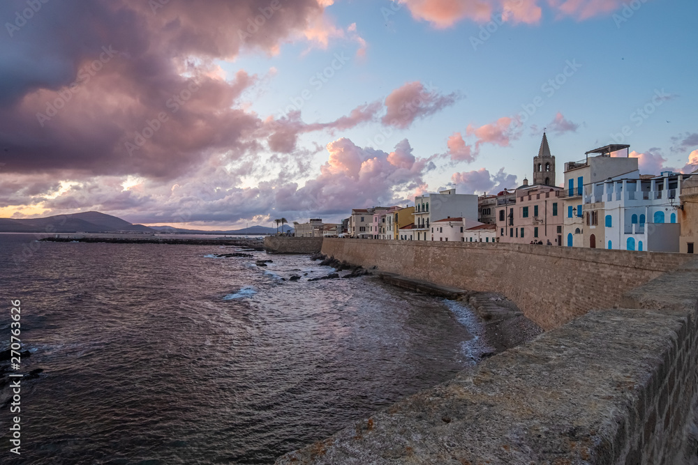 Sunset/Dusk along the sea front of Alghero (L'Alguer), province of Sassari , Sardinia, Italy.  Famous for the beauty of its coast and beaches and its historical city center.